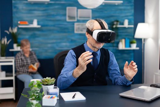 Happy pensioner experiencing virtual reality