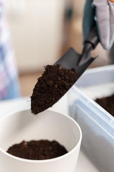 Holding shovel with fertil soil