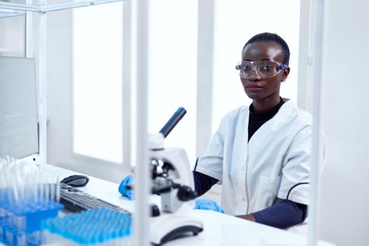 Woman of african ethnicity working in chemistry facility
