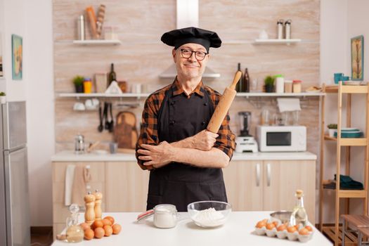 Elderly age man wearing chef bonete
