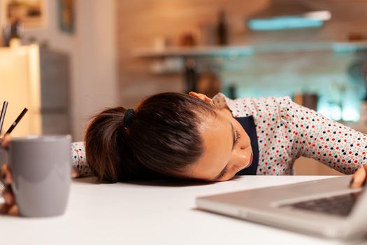 Woman falling asleep while working from home