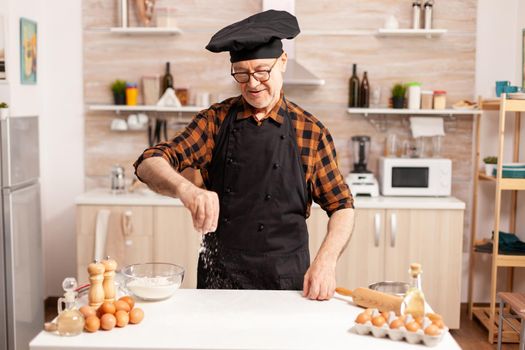 Senior chef preparing homemade bread
