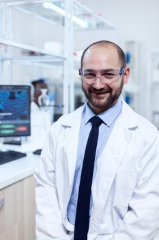 Young biochemistry scientist wearing protective glasses