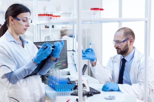 Group of scientist conducting and engineering genetic material