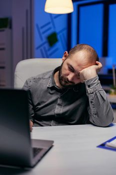 Businessman sleeping in company office
