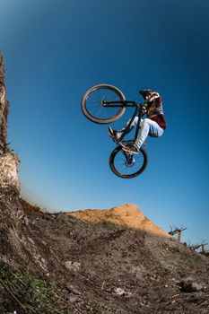 MTB Bike jump over a dirt trail