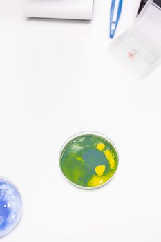 Mixed of bacteria colony in petri dish standing on table in biological scientific hospital laboratory