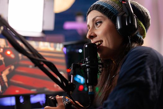 Close up of streamer woman talking into professional microphone