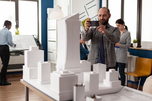 Architect profession man looking at maquette layout