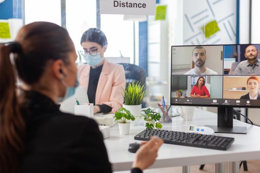 Businesswoman during remove video conference on computer