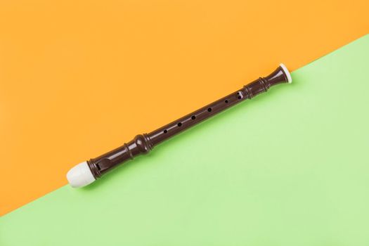 overhead view block flute dual orange green background. High quality photo