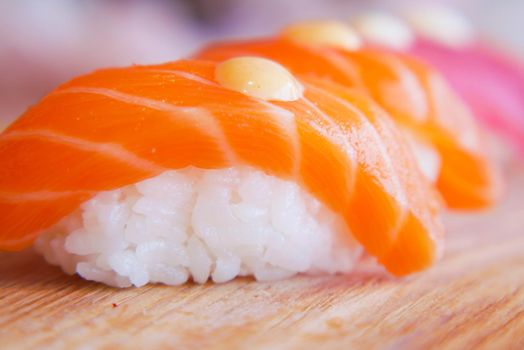 Traditional japanese nigiri sushi with salmon on plate