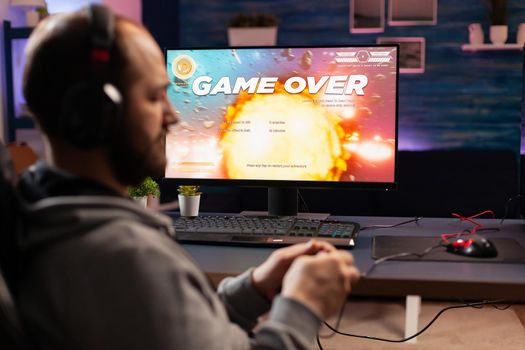 Disappointed esport gamer losing virtual tournament videogame