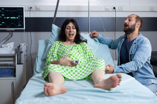 Woman with pregnancy having painful contractions