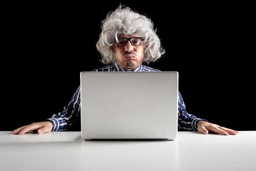 An old man boomer snorting while using computer 