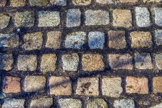 Close up view on old historical cobblestone roads and walkways all over europe