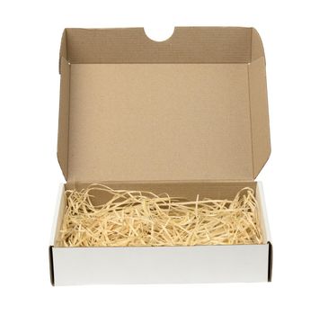 rectangular open corrugated paper box with sawdust inside. Packaging
