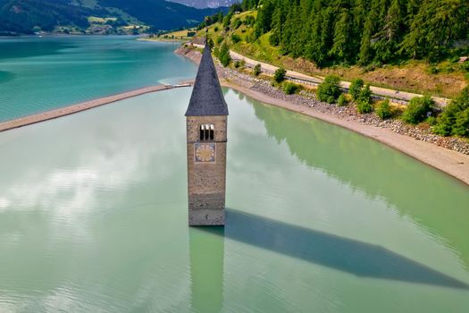 Submerged bell Tower of Curon Venosta aor Graun im Vinschgau on Lake Reschen aerial view