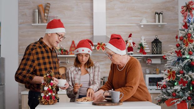 Family with santa hat speding christmas holiday together enjoying christmastime