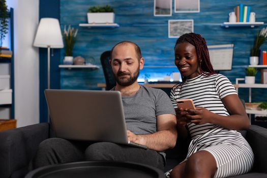 Modern interracial couple using devices and technology