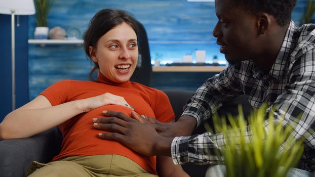 Married interracial couple waiting for baby and parenthood