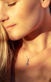 Girl with a Beautiful Pendant on her Neck