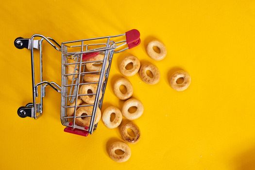 carts with groceries shopping supermarket store yellow background