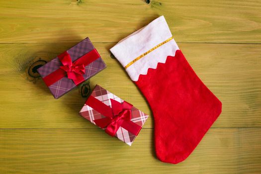 Christmas Stocking and gifts on wooden table