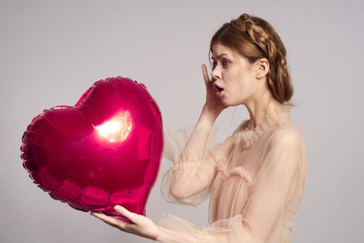 pretty woman heart balloon posing romance holiday. High quality photo