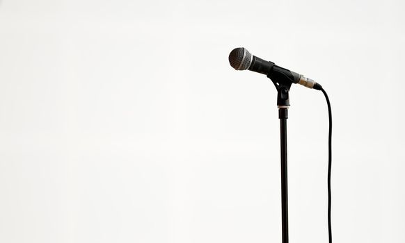 concert microphone on a drain on a white background in the hall in isolation 