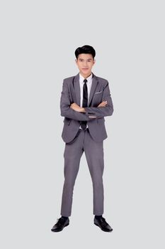 Full length portrait businessman in suit with crossed his arms standing isolated on white background, young asian business man is manager or executive having confident is positive with success.