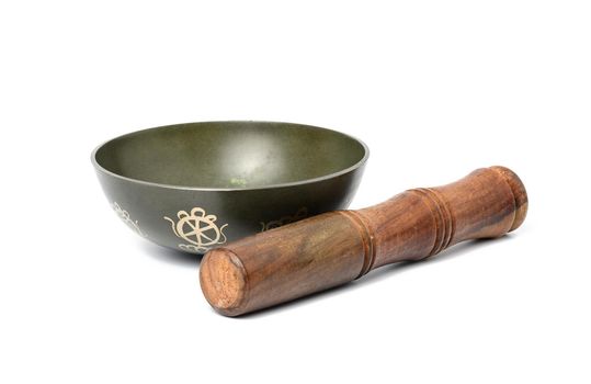 copper singing bowl and wooden mallet isolated on white background. Musical instrument for meditation, relaxation, various medical practices related to biorhythms