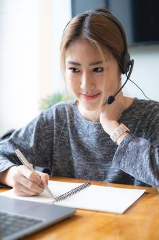 Customer service representative with a headset and work at home. business support team concept.