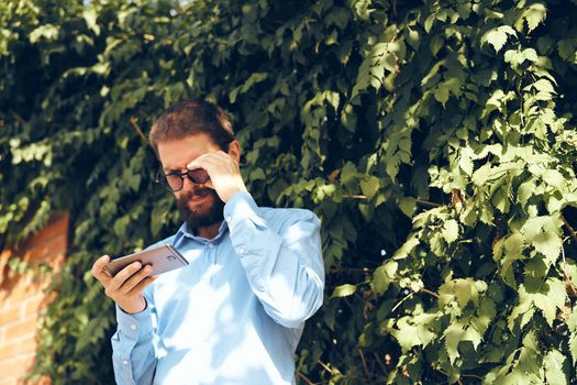 business man with phone outdoors communication lifestyle. High quality photo