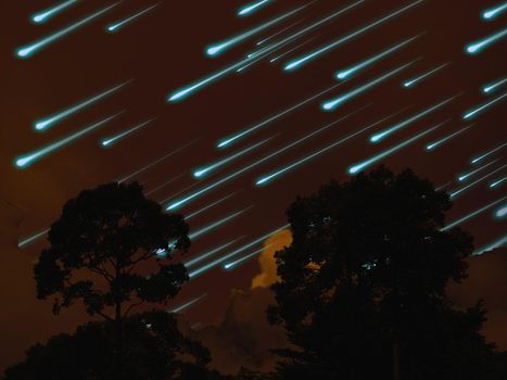meteor on the night sky dark orange cloud and tree in tropic forest