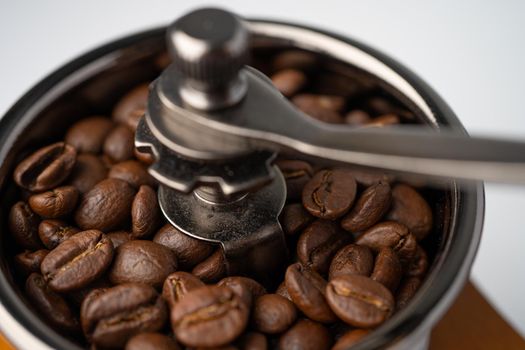 Coffee bean roasted in wooden grinder. 