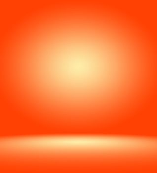 Orange photographic studio background vertical with soft vignette. Soft gradient background. Painted canvas studio backdrop.