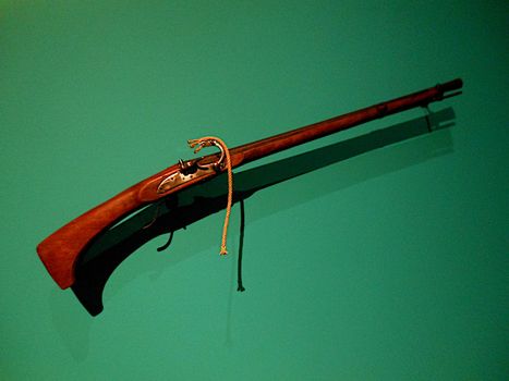 Old musket hanging on the wall