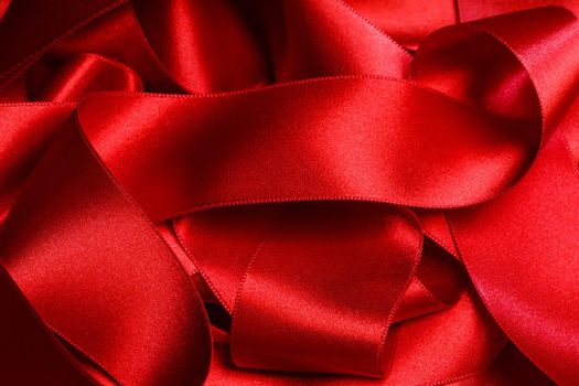 Heap of red ribbons background