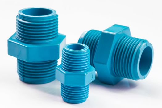 PVC pipe fittings on white background.