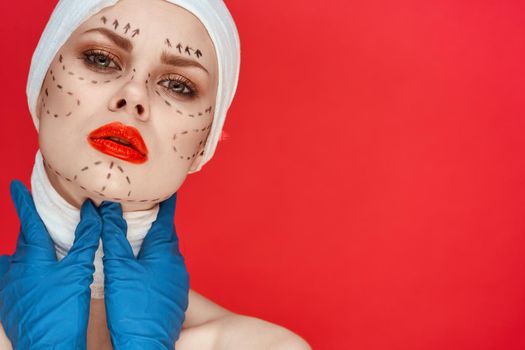 a person posing in blue gloves red lips surgery facial rejuvenation studio lifestyle. High quality photo