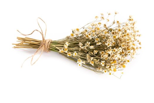 Composition with chamomile flowers and homemade cosmetic, essential oil, sopa,  on white background, top view.