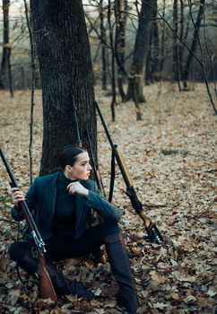 hunting nature environment. military fashion. achievements of goals. successful hunt. hunting sport. woman with weapon. Target shot. girl with rifle. chase hunting. Gun shop. female hunter in forest