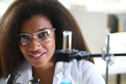 Black female chemist student conducting research