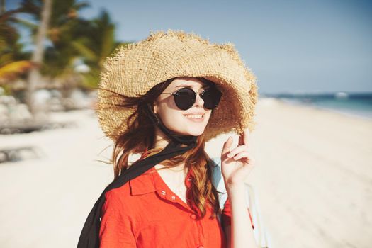 woman in hat on island landscape summer tropics