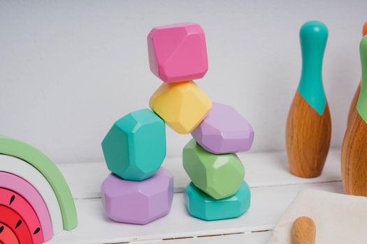 Wooden cubes with different faces for the development of coordination and balancing.