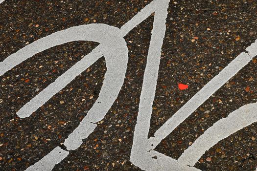 Heart on a street in a sign of a bicycle path
