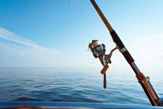Fishing rod on a sailboat in open sea, close up