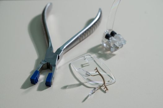 Disassembled glasses and instruments by an ophthalmologist.