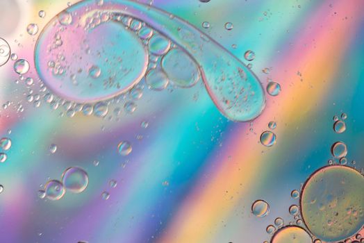 Holographic rainbow abstract background picture made with oil, water and soap